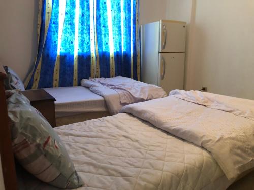 En eller flere senger på et rom på Tow bedroom flat at Muntazah Sharm Elshikh