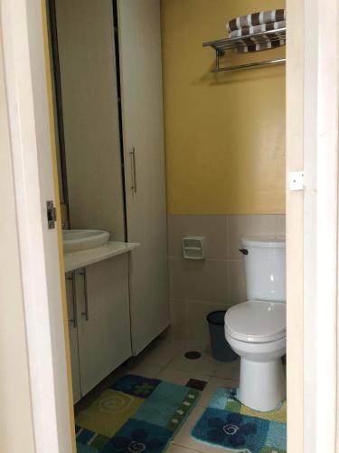 a bathroom with a toilet and a sink at Camella Northpoint in Davao City