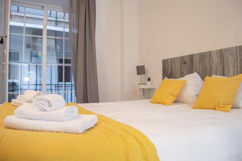 Posteľ alebo postele v izbe v ubytovaní Novam Loft Terrace Centro Málaga