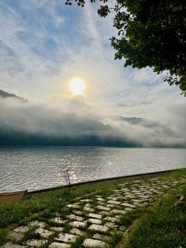 a sun setting over a body of water at Nautica Bahna in Orşova