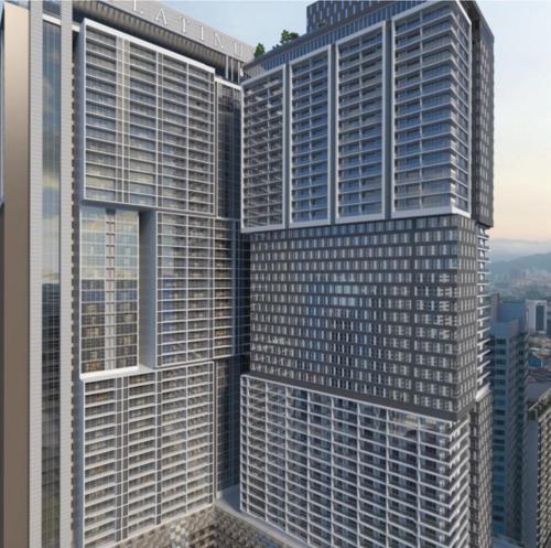 two tall buildings in a city with a window at THE FACE Style in Kuala Lumpur