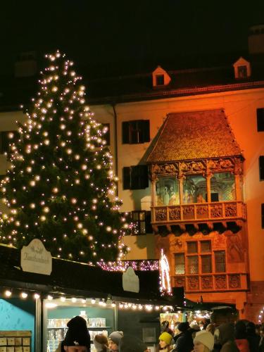a christmas tree is lit up in front of a building at Haus Knoll in Imsterberg