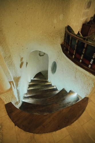 a spiral staircase in a building with a stair case at Hu of Cappadocia - Special Class in Uchisar