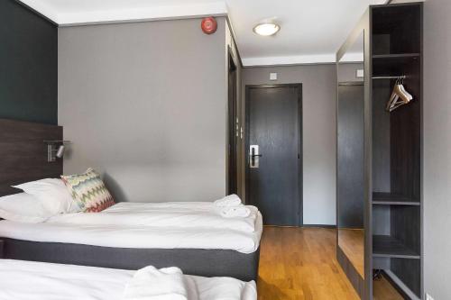 Ένα ή περισσότερα κρεβάτια σε δωμάτιο στο Easy Stay Haugesund