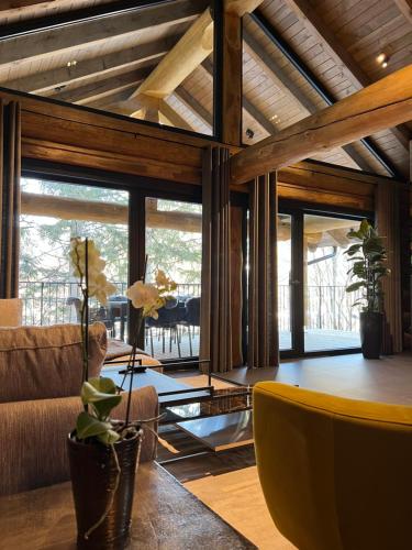a living room with a couch and a table at Chalet Deux B in Bad Kleinkirchheim