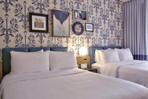 Postel nebo postele na pokoji v ubytování Hotel Indigo New Orleans - French Quarter by IHG