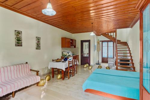 a living room with a couch and a table at Iliopetra in Douliana