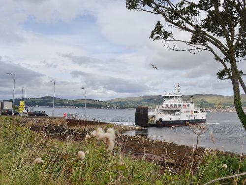 a ferry boat is docked in the water at Glenfiddich in Largs