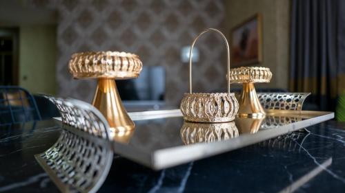 a table with three lights on top of it at My Palace Rooms Hotel SAW in Istanbul