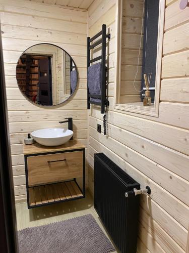 a bathroom with a sink and a mirror at ЗаҐора in Tatariv