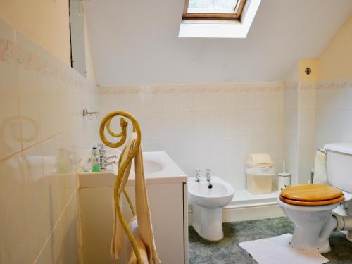 a bathroom with a toilet and a sink at The Quay in Pembroke