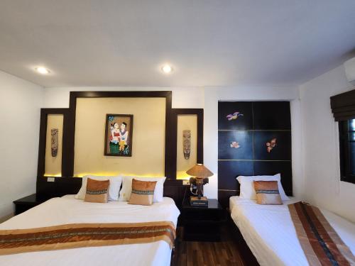 Letto o letti in una camera di Pai Residence Hotel