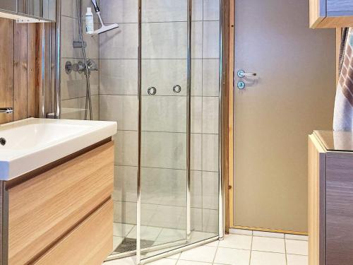 a bathroom with a shower and a sink at Holiday home Tisleidalen II in Tisleidalen