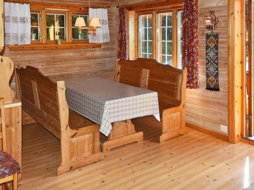 a wooden room with a table in a cabin at 5 person holiday home in olden in Olden
