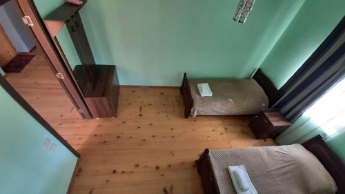an overhead view of a room with two beds at Guest house-Lile in Mestia