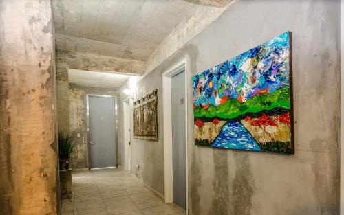 a painting hanging on a wall in a hallway at Dos Aguas in Rio Grande