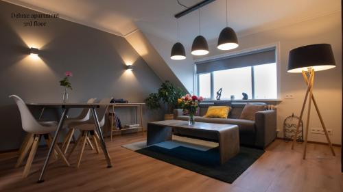 a living room with a couch and a table at Apartments Reykjavik in Reykjavík