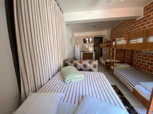 Postel nebo postele na pokoji v ubytování Hotel Nelly