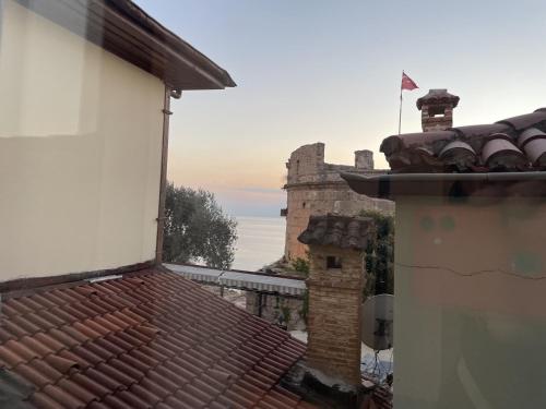 a building with a flag on top of a roof at Hıdırlık Boutique Hotel in Antalya