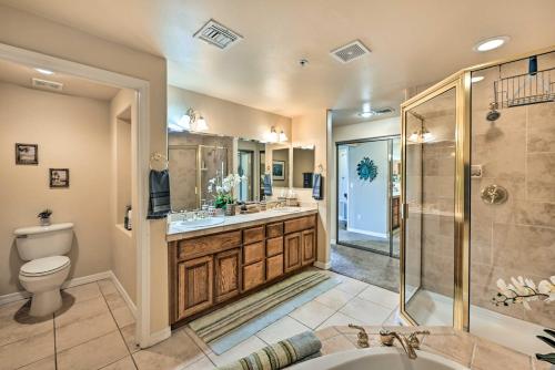 a bathroom with a toilet sink and a shower at Step-Free Bullhead City Condo with Balcony! in Bullhead City