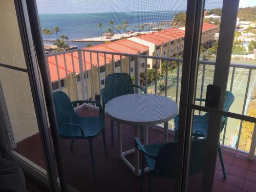 a balcony with a table and chairs and the ocean at Islamorada Paradise Overlooking the Fabulous Florida Bay. in Tavernier