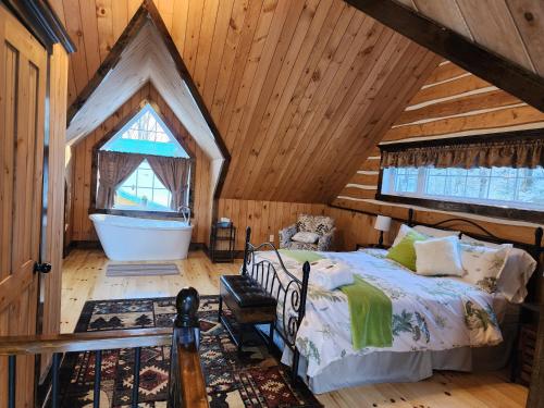 Postel nebo postele na pokoji v ubytování Domaine Rivière Sacacomie