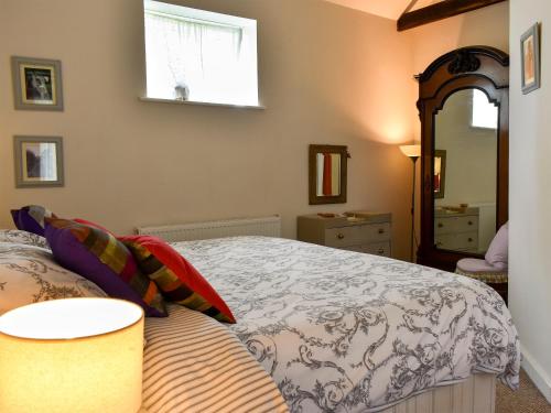 Katil atau katil-katil dalam bilik di Evie Rose Cottage