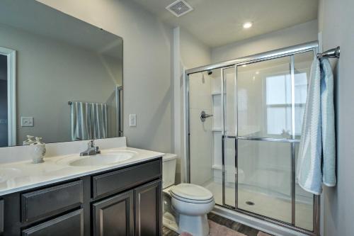 a bathroom with a shower and a sink and a toilet at Cozy Durham Home - 9 Mi to Duke University! in Durham