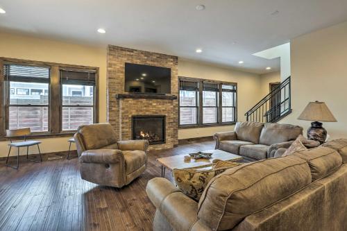 a living room with a couch and a fireplace at half Mi to Dtwn Golden Gem with Patios! in Golden