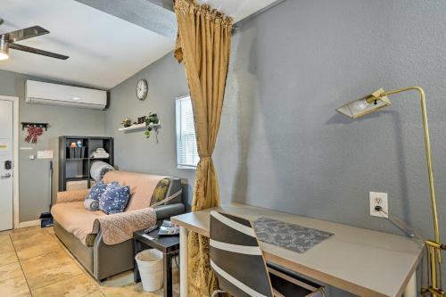a living room with a desk and a couch at North Las Vegas Studio with Fire Pit 10 Mi to Strip in Las Vegas