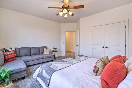 a living room with a bed and a couch at Modern Apartment with Beautiful Mountain Views! in St. George