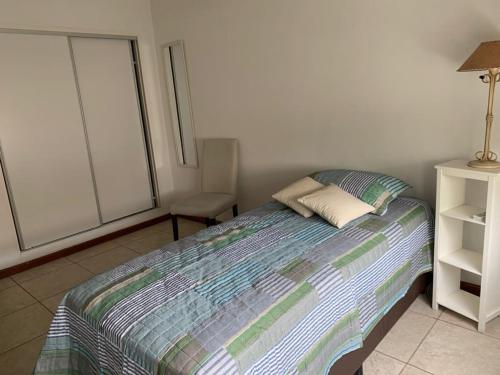 Una cama o camas en una habitación de Condominio de Paz