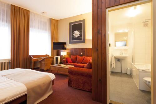 Ліжко або ліжка в номері Hotel Dordrecht