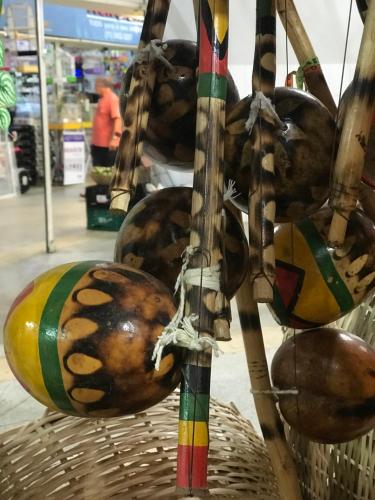 a bunch of coconuts hanging in a basket at TURISHOUSE SUITES in Salvador