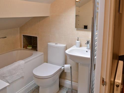 a bathroom with a toilet and a sink at Parkview in Skipton