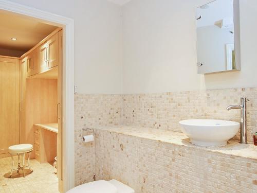 a bathroom with a white sink and a toilet at Dales Chapel in Middleton in Teesdale