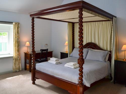 Posteľ alebo postele v izbe v ubytovaní Courtyard Cottage