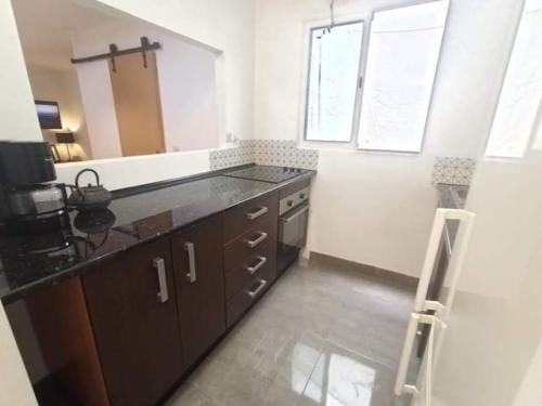 a kitchen with a sink and a counter top at Piso centro de Cádiz in Cádiz