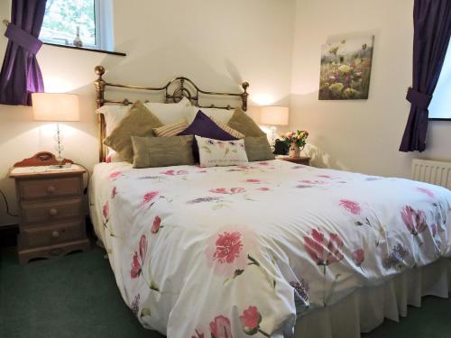 En eller flere senger på et rom på Moorlands Cottage