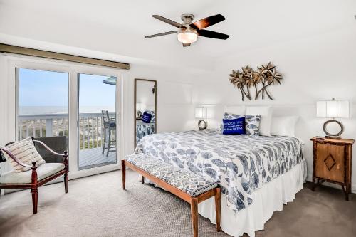 a bedroom with a bed and a ceiling fan at 95100 Sandpiper in Fernandina Beach