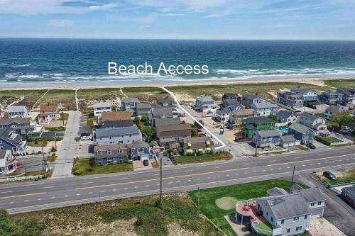 an aerial view of a beach area with houses and the ocean at Sunshine House steps from Beach in Seabrook