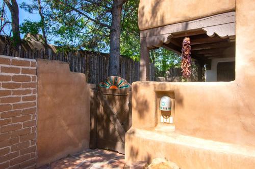 a gate to a fence with a fence at Las Brisas de Santa fe in Santa Fe