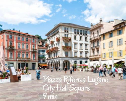 Nespecifikovaný výhled na destinaci Lugano nebo výhled na město při pohledu z apartmánu