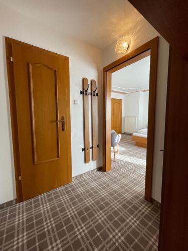 a room with a door open to a bedroom at Gästehaus Pöll in Mayrhofen