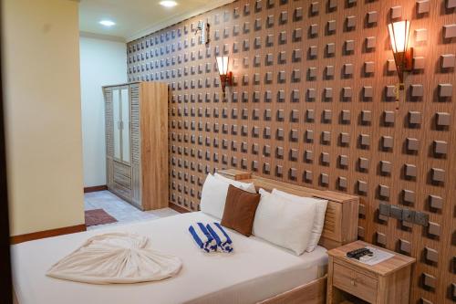Postel nebo postele na pokoji v ubytování Banyan Villa Maldives Dhangethi