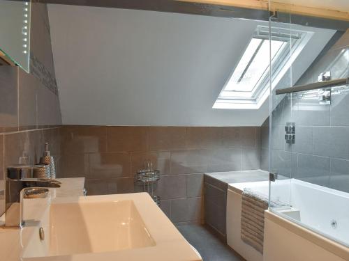 a bathroom with a sink and a skylight at Georges View in Whitby