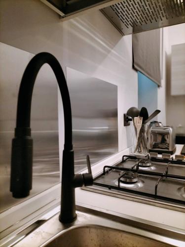 Cucina o angolo cottura di Queen apartment al Palazzetto