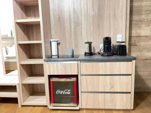 a counter with a cocacolaacistacistacistacist at Luxury Apartment Monte Carlo in Pörtschach am Wörthersee