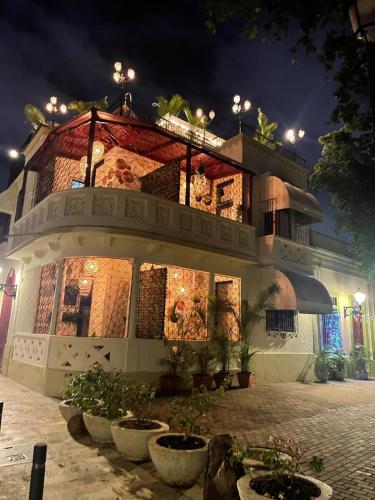 a building with a lit up facade at night at Studio 27 Colonial, Centro Histórico in Santo Domingo
