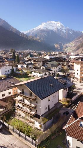an aerial view of a city with a mountain at Gästehaus Pöll in Mayrhofen
